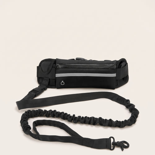 Svart handsfree-hundbälte med ficka, dämparkoppel och reflexband, detaljbild